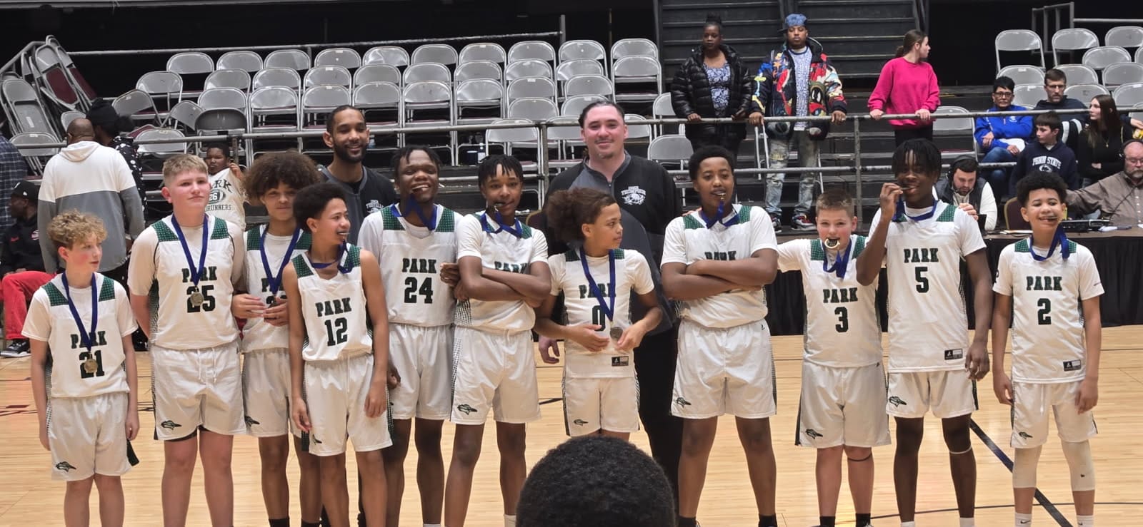 Ross with his basketball team after winning championship