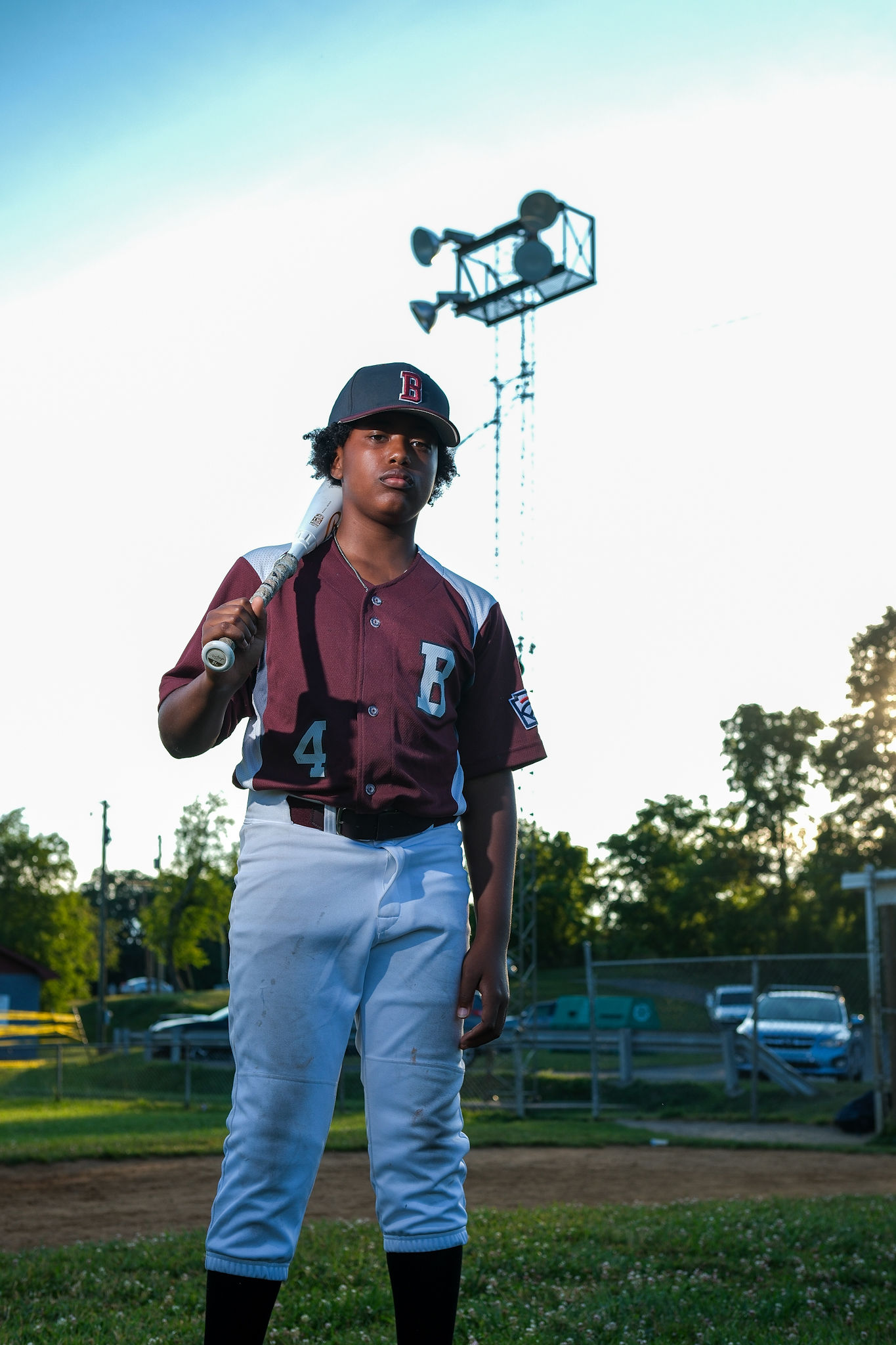 Ross in his baseball uniform at golden hour